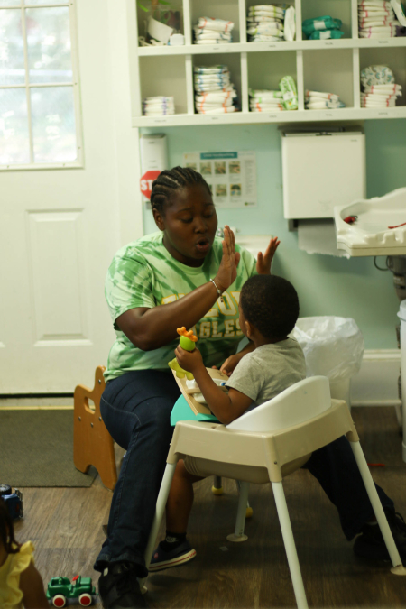 Little People Preschool apprentice with student